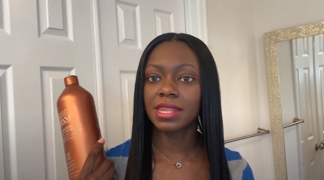 girl holding hair moisturized in hands