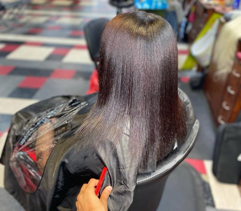 relaxed hair straightened with flat iron and heat protectants