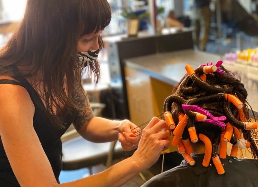 stylist doing perm job